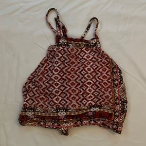 Cute multi-colored crop top. Razor cut with cross straps in back with a tie.